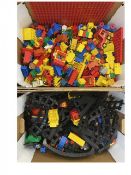 A Duplo train set with a large quantity of tracks, figures and assorted blocks
