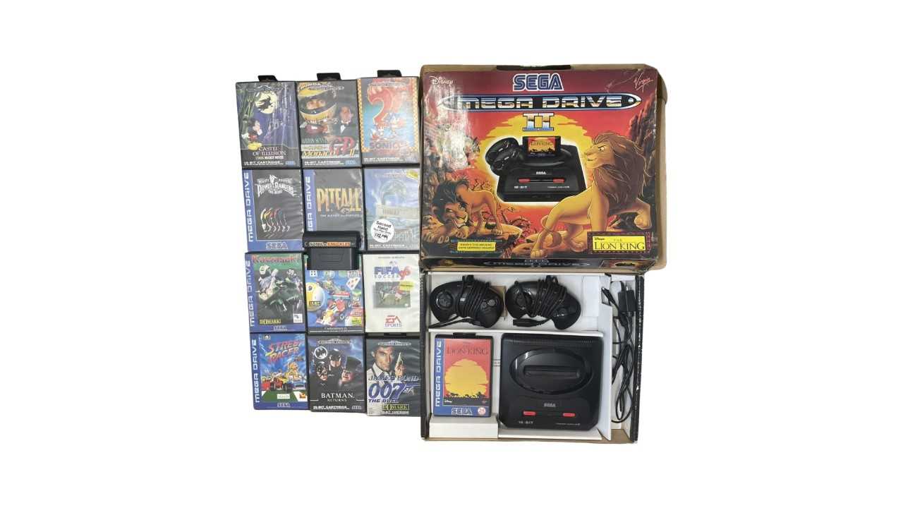 A boxed Sega Mega Drive II console, game pads and connection cables - Lion King edition, to also