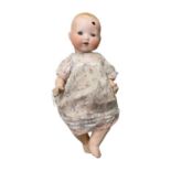 An Armand Marseille bisque head doll, with painted hair, blue eyes, opened mouthed with 2 teeth,