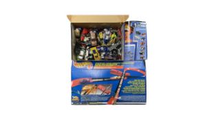 A boxed Mattel Hotwheels Starter set, with a collection of loose vehicles