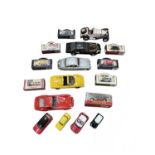 A mixed lot of various large unboxed die-cast sports cars and boxed model cars.