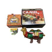 A mixed lot of various tin plate toys, to include: - A boxed camel - A boxed bluebird - A wind-up