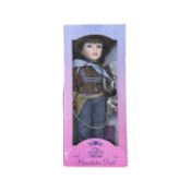 A boxed Leonardo Collection porcelain head Cowboy doll, LP4356 'Luke'.