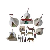 A collection of vintage hand-painted wooden animals and people, together with a set of cloth