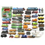 A collection of die-cast Thomas the Tank Engine trains and vehicles by ERTL