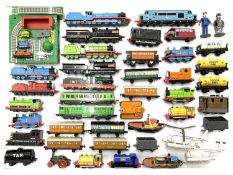 A collection of die-cast Thomas the Tank Engine trains and vehicles by ERTL