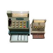 A pair of vintage toy tills, to include: - A plastic Maxicash example - A plastic example by