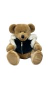 A limited edition Harrods Teddy Bear, 2001, in green furred jacket, seated height approximately: