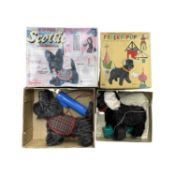 A pair of vintage boxed battery operated toys, formed as dogs, to include: - Scottie dog by Miniflex