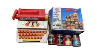 A pair of retro toys, to include: - A Tomy Tutor Typewriter - A boxed set of 18 Heinz play cans