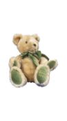 A limited edition Harrods Teddy Bear, 1995, with green monogrammed bow, seated height approximately: