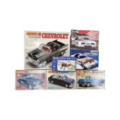 A mixed lot of boxed 1970s plastic car building kits, to include: - Matchbox: 57 Belair