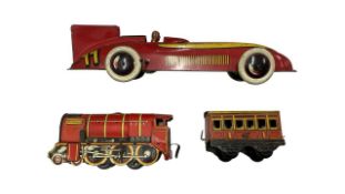 A pair of Wells Brimtoy tin-plate clockwork toys, to include: - Britannia locomotive and tender -