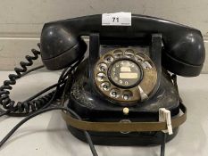 Vintage black telephone with brass mounts