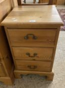 Modern pine three drawer bedside cabinet
