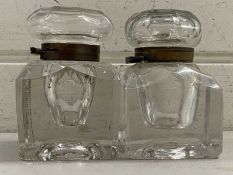 Two large clear glass ink wells