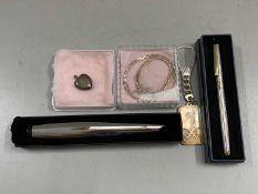 Mixed Lot: A silver key fob mounted with silver ingot, cased fountain pen, heart shaped locket and