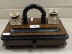 Late 19th Century walnut and ebonised desk stand with clear glass ink wells