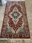 Small 20th Century carpet decorated with geometric design on a red and blue background