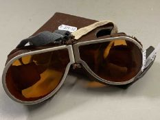 Pair of vintage amber tinted flying goggles with accompanying case