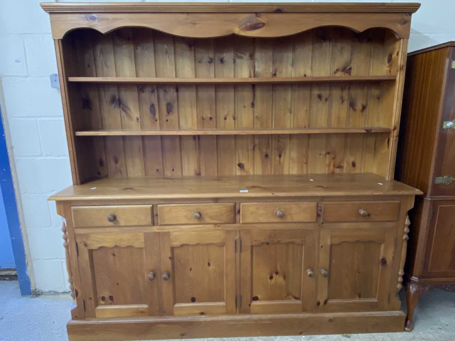 Modern pine dresser with four door, four drawer base