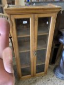 Narrow pine two door display cabinet