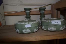 Pair of green Wedgwood Jasper ware candlesticks together with a pair of matching trinket pots