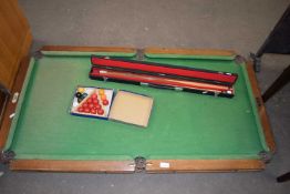 Small table top snooker table together with cue and balls
