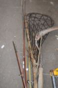 Mixed lot of assorted fishing rods together with a Lacrosse stick and a vintage sickle