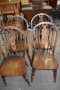 Set of four modern wheel back kitchen chairs