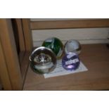 Four Caithness paperweights, Sorcerers Apprentice, Moon Crystal, Pastel and Star Watch