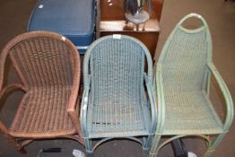 Three wicker child's chairs in the Lloyd Loom style