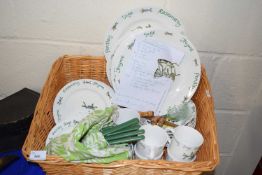 Green and cream picnic set decorated with herbs together with matching utensils