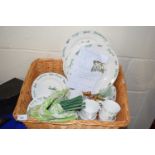 Green and cream picnic set decorated with herbs together with matching utensils