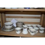 Quantity of tea wares with black and floral decoration and gilt trim to include tea cups, plates,