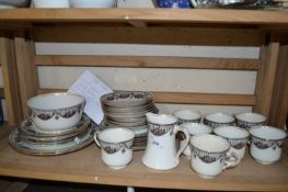 Quantity of tea wares with black and floral decoration and gilt trim to include tea cups, plates,