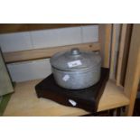 Wooden stand together with aluminium pot and cover