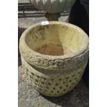 Circular concrete planter with meshed decoration