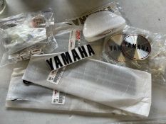 Quantity of various parts for a Yamaha motorcycle to include badge emblems to include front