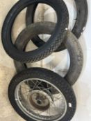 Three tyres and a wheel and tyre combination - tyre size 3.00S18 Michelin, 3.25/19, 4.00/18 and