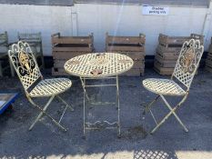 Metal garden bistro set consisting of a table and two chairs