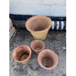 Mixed lot of terracotta plant pots and two iron planters