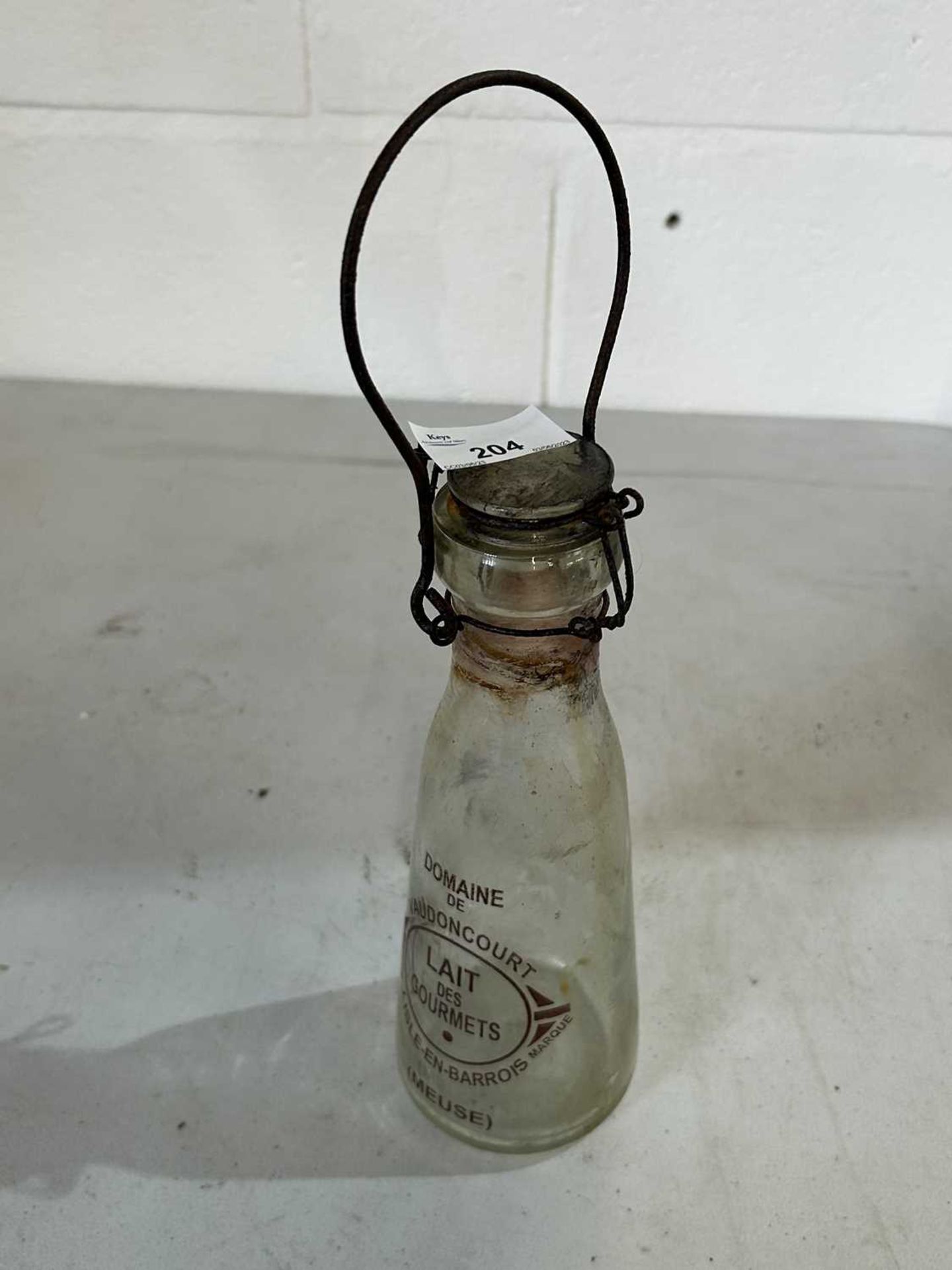 Vintage milk bottle with topper and handle