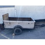 Small domestic iron framed car trailer with lights