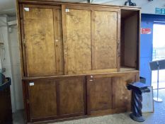 Large pine framed and plywood panelled cabinet with sliding doors, 259cm wide