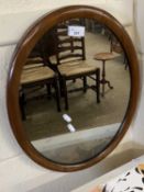 Oval mahogany framed wall mirror