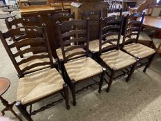 Set of eight reproduction rush seat Lancashire style ladder back dining chairs