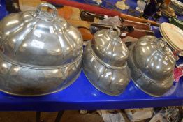 Six Victorian polished pewter meat covers, various sizes