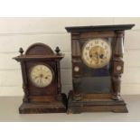 Two late 19th Century mantel clocks in stained wooded cases