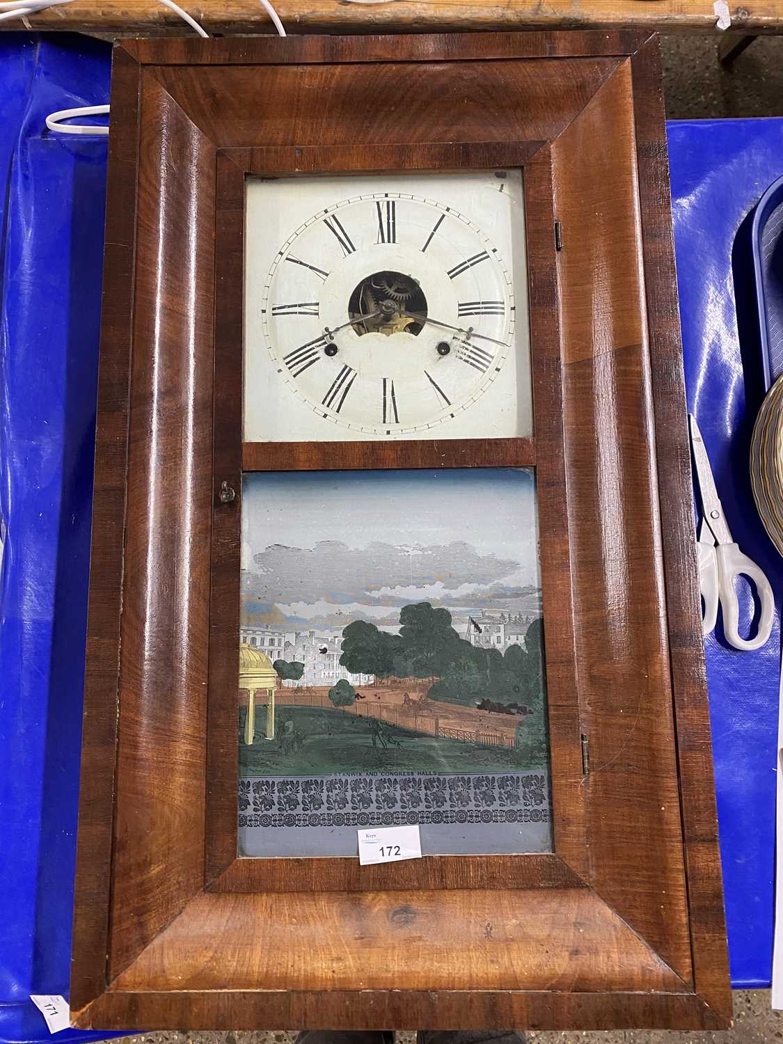 An American wall clock by Brewster Manufacturing Company, Bristol, Connecticut